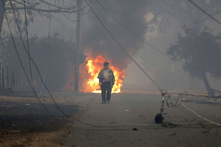 Man walking away from fire